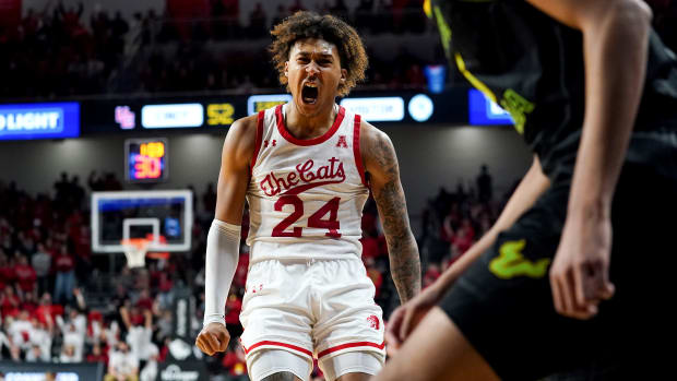 Cincinnati Bearcats guard Jeremiah Davenport (24) reacts after a made 3-point basket in the second half of a men's NCAA basketball game against the South Florida Bulls, Saturday, Feb. 26, 2022, at Fifth Third Arena in Cincinnati. The South Florida Bulls won, 54-52. South Florida Bulls At Cincinnati Bearcats Basketball 124