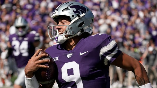 Kansas State quarterback Adrian Martinez runs with the ball during a game against Texas Tech.