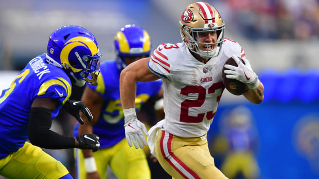 San Francisco 49ers running back Christian McCaffrey (23) runs the ball against Los Angeles Rams cornerback Derion Kendrick (6) during the second half at SoFi Stadium.
