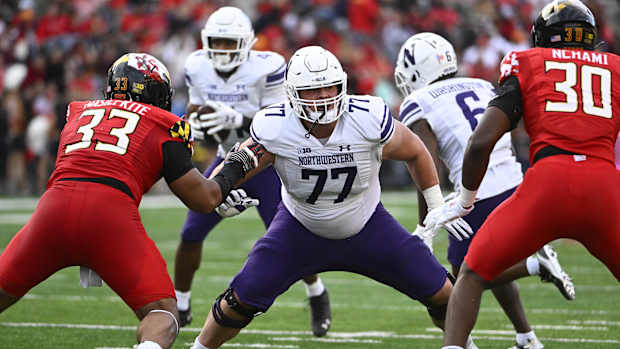 Northwestern Wildcats offensive lineman Peter Skoronski (77) prepares to block against the Maryland Terrapins at SECU Stadium.