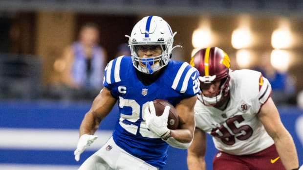 Oct 30, 2022; Indianapolis, Indiana, USA; Indianapolis Colts running back Jonathan Taylor (28) runs the ball in the first quarter against the Washington Commanders at Lucas Oil Stadium.