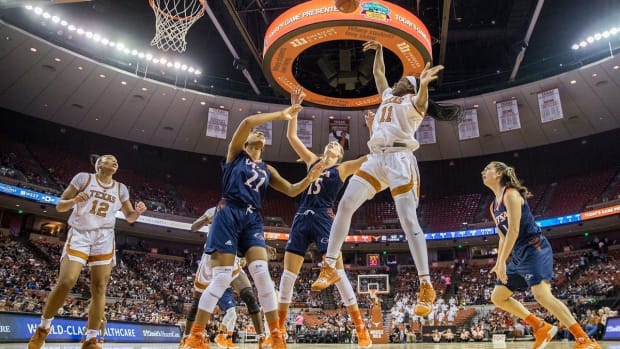 Texas Longhorns guard Joanne Allen-Taylor (11) shoots over UTSA Roadrunners forward Marie Benson (21) and UTSA Roadrunners forward Timea Toth (15) and score in the 3rd quarter during an NCAA women's basketball game at the Frank Erwin Center in Austin, Texas [RICARDO B. BRAZZIELL/AMERICAN-STATESMAN]

Rbb