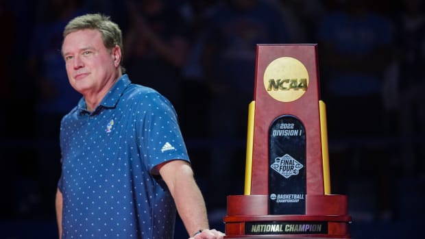 Oct 14, 2022; Lawrence, Kansas, US; Kansas Jayhawks head coach Bill Self stands next to the 2022 NCAA National Championship Trophy during Late Night at the Phog at Allen Fieldhouse. Mandatory Credit: Jay Biggerstaff-USA TODAY Sports