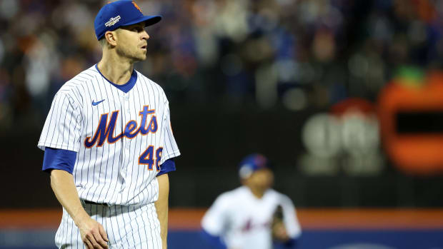Mets pitcher Jacob deGrom walks off the field after an inning in a game vs. the San Diego Padres.