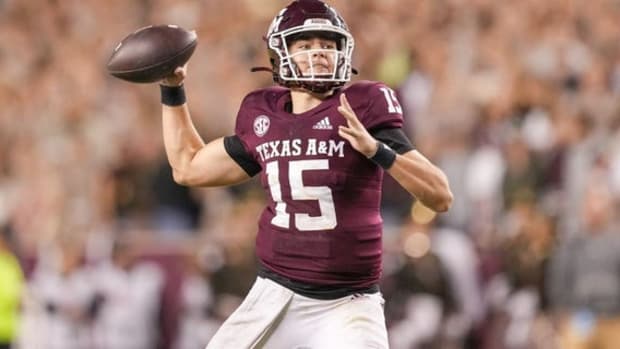 Texas A&M Aggies quarterback Conner Weigman attempts a pass during a college football game in the SEC.