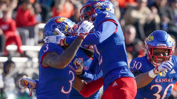 Nov 5, 2022; Lawrence, Kansas, USA; Kansas Jayhawks cornerback Ra'Mello Dotson (3) celebrates with cornerback Cobee Bryant (2) against the Oklahoma State Cowboys after an interception during the first half of the game at David Booth Kansas Memorial Stadium. Mandatory Credit: Denny Medley-USA TODAY Sports