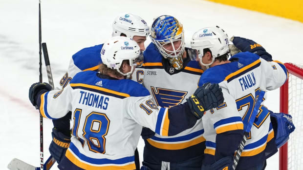 Nov 12, 2022; Las Vegas, Nevada, USA; St. Louis Blues goaltender Jordan Binnington (50) celebrates with St. Louis Blues center Ryan O'Reilly (90), St. Louis Blues center Robert Thomas (18), and St. Louis Blues defenseman Justin Faulk (72) after defeating the Vegas Golden Knights 3-2 at T-Mobile Arena. Mandatory Credit: Stephen R. Sylvanie-USA TODAY Sports