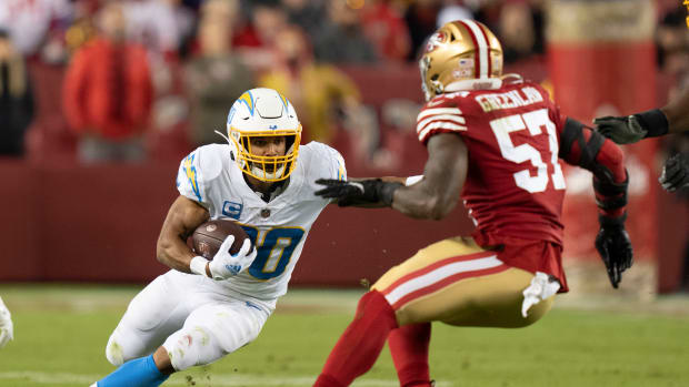 November 13, 2022; Santa Clara, California, USA; Los Angeles Chargers running back Austin Ekeler (30) runs with the football against San Francisco 49ers linebacker Dre Greenlaw (57) during the first quarter at Levi's Stadium. Mandatory Credit: Kyle Terada-USA TODAY Sports