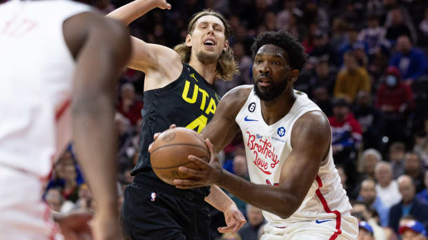 Philadelphia 76ers center Joel Embiid (21) drives past Utah Jazz forward Kelly Olynyk (41) during the second quarter at Wells Fargo Center.