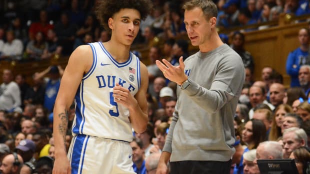 Nov 11, 2022; Durham, North Carolina, USA; Duke Blue Devils head coach Jon Scheyer (right) talks to guard Tyrese Proctor during the second half at Cameron Indoor Stadium.