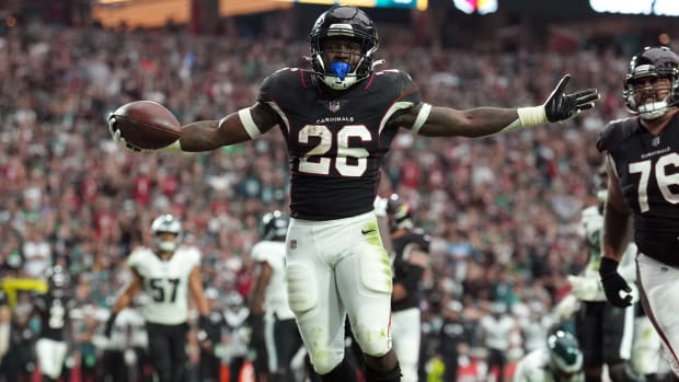 Cardinals running back Eno Benjamin (26) celebrates scoring his touchdown against the Eagles.