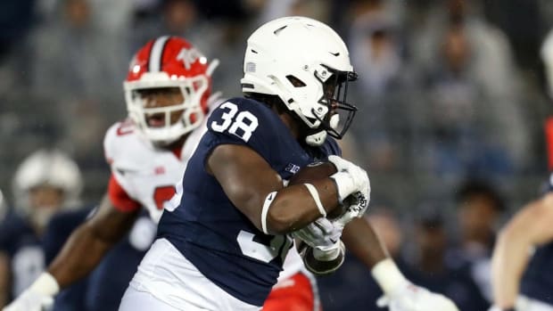 Nov 12, 2022; University Park, Pennsylvania, USA; Penn State Nittany Lions running back Tank Smith (38) runs with the ball during the fourth quarter against the Maryland Terrapins at Beaver Stadium. Penn State defeated Maryland 30-0. Mandatory Credit: Matthew OHaren-USA TODAY Sports