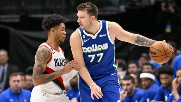 Nov 12, 2022; Dallas, Texas, USA; Portland Trail Blazers guard Anfernee Simons (1) guards Dallas Mavericks guard Luka Doncic (77) during the first quarter at the American Airlines Center. Mandatory Credit: Jerome Miron-USA TODAY Sports
