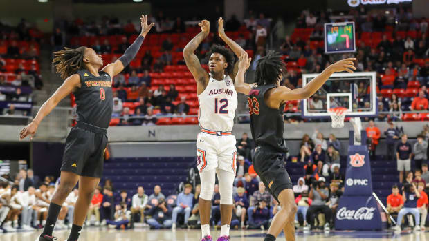 Zep Jasper hits a three to start the game vs Winthrop.