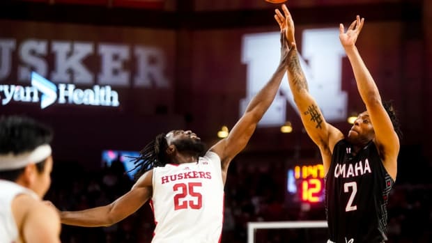 Nov 10, 2022; Lincoln, Nebraska, USA; Nebraska-Omaha Mavericks guard Jaeden Marshall (2) shoots the ball against Nebraska Cornhuskers guard Emmanuel Bandoumel (25) during the second half at Pinnacle Bank Arena. Mandatory Credit: Dylan Widger-USA TODAY Sports