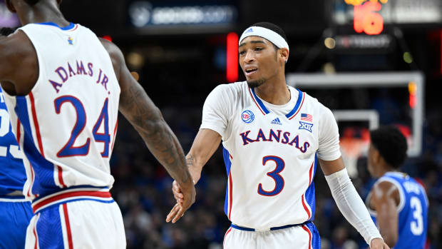 Nov 15, 2022; Indianapolis, Indiana, USA; Kansas Jayhawks guard Dajuan Harris Jr. (3) high fives Kansas Jayhawks forward Jalen Wilson (10) during the first half against the Duke Blue Devils at Gainbridge Fieldhouse.