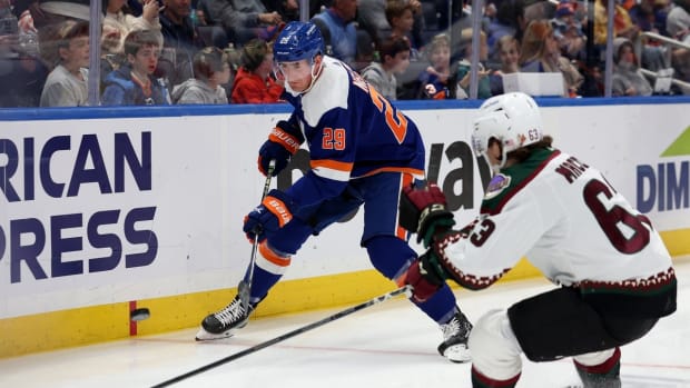 Nov 10, 2022; Elmont, New York, USA; New York Islanders center Brock Nelson (29) controls the puck against Arizona Coyotes left wing Matias Maccelli (63) during the first period at UBS Arena. Mandatory Credit: Brad Penner-USA TODAY Sports