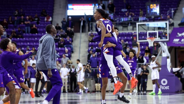 Northwestern State Demons guard Demarcus Sharp (0) celebrates with teammates after the win against the TCU Horned Frogs