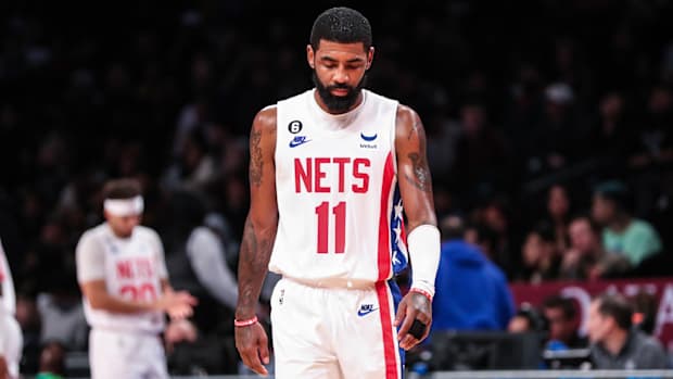 Kyrie Irving looks down on court.