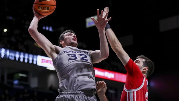 Nov 15, 2022; Cincinnati, Ohio, USA; Xavier Musketeers forward Zach Freemantle (32) shoots against Fairfield Stags forward Zach Crisler (20) in the second half at Cintas Center. Mandatory Credit: Katie Stratman-USA TODAY Sports