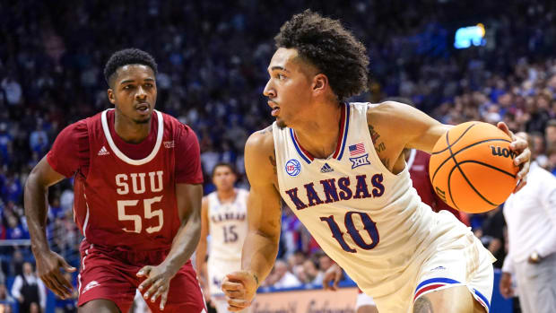 Nov 18, 2022; Lawrence, Kansas, USA; Kansas Jayhawks forward Jalen Wilson (10) dribbles as Southern Utah Thunderbirds guard Tevian Jones (55) defends during the second half at Allen Fieldhouse. Mandatory Credit: Denny Medley-USA TODAY Sports