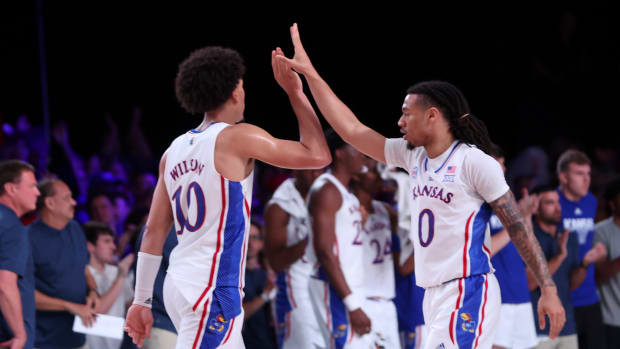 Nov 23, 2022; Paradise Island, BAHAMAS; Kansas Jayhawks forward Jalen Wilson (10) and Kansas Jayhawks guard Bobby Pettiford Jr. (0) celebrate during the second half against the North Carolina State Wolfpack at Imperial Arena. Mandatory Credit: Kevin Jairaj-USA TODAY Sports