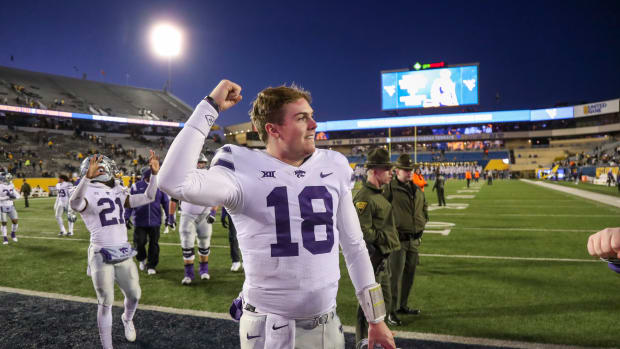 Nov 19, 2022; Morgantown, West Virginia, USA; Kansas State Wildcats quarterback Will Howard (18) celebrates after defeating the West Virginia Mountaineers at Mountaineer Field at Milan Puskar Stadium.
