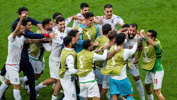 Iran celebrates a win against Wales.