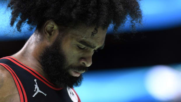 Chicago Bulls guard Coby White (0) reflects during a time out during the second half against the Charlotte Hornets at the Spectrum Center