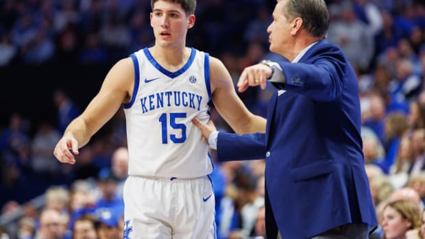 Jan 31, 2024; Lexington, Kentucky, USA; Kentucky Wildcats guard Reed Sheppard (15) talks with head coach John Calipari during the first half against the Florida Gators at Rupp Arena at Central Bank Center. Mandatory Credit: Jordan Prather-USA TODAY Sports