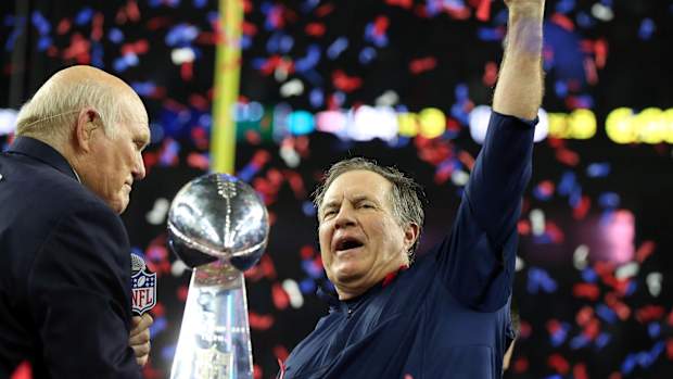 Feb 5, 2017; Houston, TX, USA; New England Patriots head coach Bill Belichick celebrates with the Vince Lombardi Trophy after beating the Atlanta Falcons during Super Bowl LI at NRG Stadium.