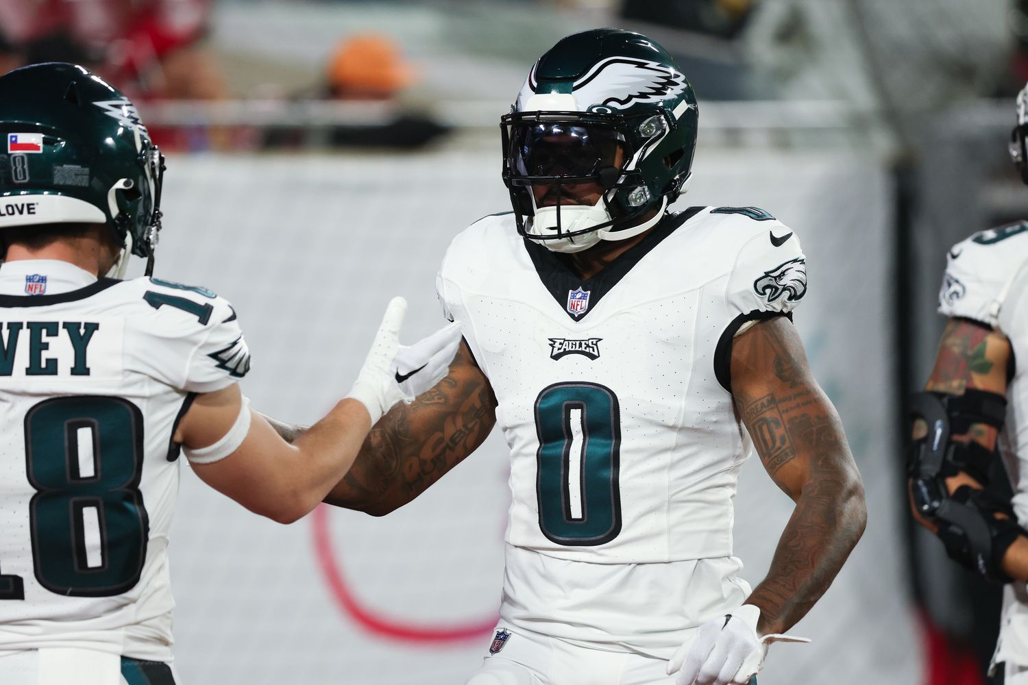 Jan 15, 2024; Tampa, Florida, USA; Philadelphia Eagles running back D'Andre Swift (0) greets wide receiver Britain Covey (18) during warm ups before a 2024 NFC wild card game at Raymond James Stadium. (Kim Klement Neitzel / USA TODAY Sports).