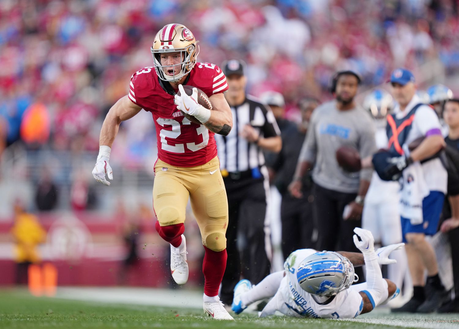 Jan 28, 2024; Santa Clara, California, USA; San Francisco 49ers running back Christian McCaffrey (23) runs with the ball against Detroit Lions safety C.J. Gardner-Johnson (2) during the first half of the NFC Championship football game at Levi's Stadium. Mandatory Credit: Kyle Terada-USA TODAY Sports