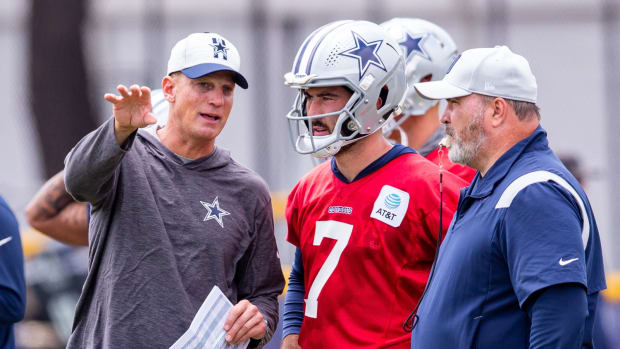 Jul 25, 2021; Oxnard, CA, USA; Dallas Cowboys quarterbacks coach Doug Nussmeier and quarterback Ben Dinucci (7) during training camp at the Marriott Residence Inn.