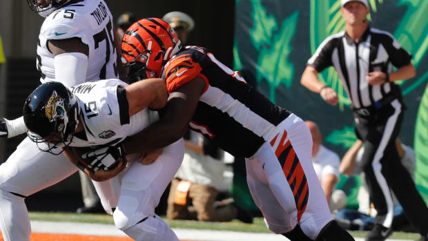 Oct 20, 2019; Cincinnati, OH, USA; Jacksonville Jaguars quarterback Gardner Minshew (15) is sacked by Cincinnati Bengals defensive tackle Geno Atkins (97) during the first half at Paul Brown Stadium. (David Kohl / USA TODAY Sports).