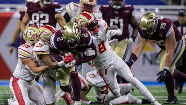 Michigan Panthers' Stevie Scott ll (2) is tackled by three defenders during a game against the Birmingham Stallions at Ford Field in Detroit on Saturday, May 20, 2023.  