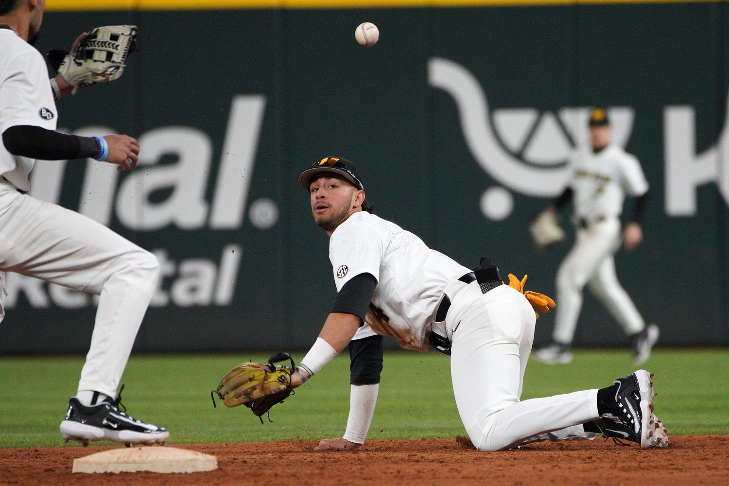 Feb 18, 2023; Arlington, TX, USA; Missouri Tigers infielder Matt Garcia (4) throws to infielder Justin Colon (12) in a 6-5 win against Texas Longhorns at Globe Life Field. Mandatory Credit: Dustin Safranek-USA TODAY Sports