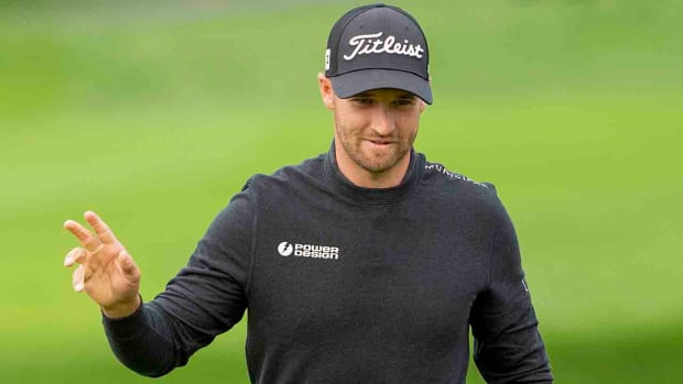 Wyndham Clark acknowledges the crowd after making a putt during the 2024 AT&T Pebble Beach Pro-Am at Pebble Beach Golf Links.