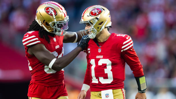 Chris Conley and Brock Purdy look at each other in celebration
