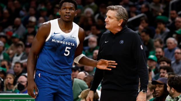 Jan 10, 2024; Boston, Massachusetts, USA; Minnesota Timberwolves head coach Chris Finch talks with guard Anthony Edwards (5) during the second quarter against the Boston Celtics at TD Garden.