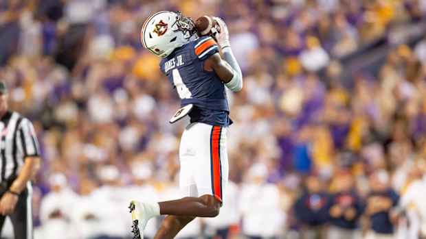 Auburn cornerback DJ James 4 makes an interception as the LSU Tigers take on the Auburn Tigers at Tiger Stadium in Baton Rouge, Louisiana, Saturday, Oct. 14, 2023.