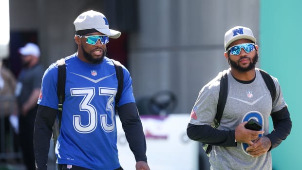 Feb 3, 2024; Orlando, FL, USA; Chicago Bears cornerback Jaylon Johnson (33) and Philadelphia Eagles running back D'andre Swift (0) participate in the AFC versus NFC Pro Bowl practice and media day at Camping World Stadium. Mandatory Credit: Nathan Ray Seebeck-USA TODAY Sports