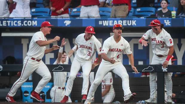 Indiana players leave the dugout to celebrate Indiana's Peter Serruto three-run homer in the seventh inning to put the Hoosiers ahead. The Hoosiers defeated Kentucky 5-3 Saturday night in the 2023 NCAA Regional at Kentucky Proud Park in Lexington. June 3, 2023.