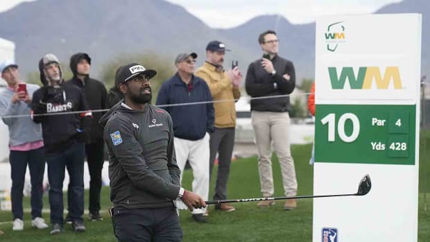 Sahith Theegala watches his ball from the 10th tee box during Round 1 of the WM Phoenix Open at TPC Scottsdale on Feb. 8, 2024.