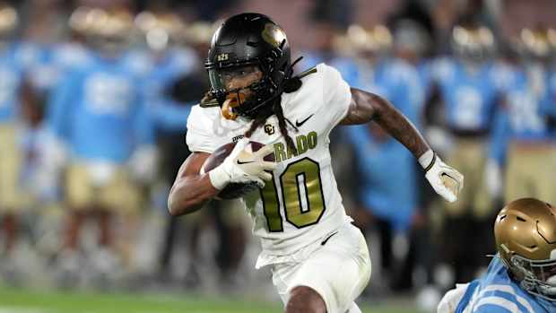 Colorado Buffaloes wide receiver Xavier Weaver (10) carries the ball against the UCLA Bruins in the second half at Rose Bowl. UCLA defeated Colorado 28-16