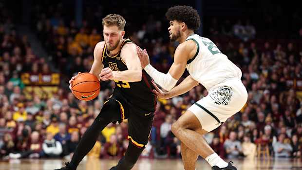 Parker Fox drives against Michigan State