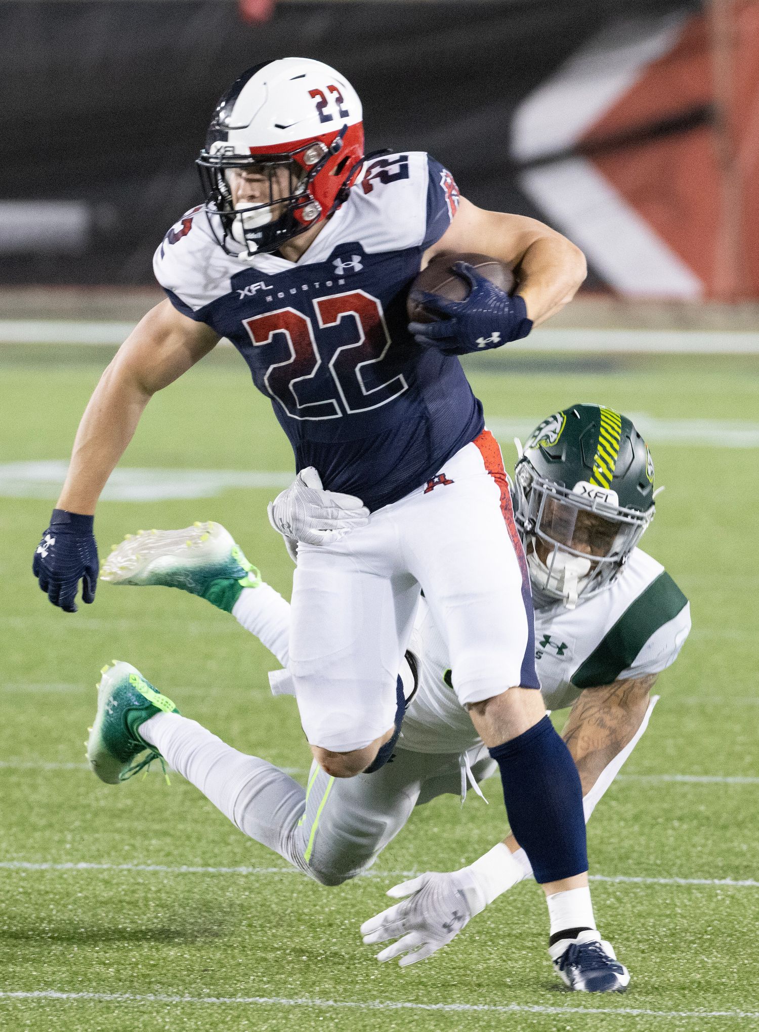 Feb 18, 2023; Houston, TX, USA; Houston Roughnecks running back Max Borghi (22) breaks a tackle by Orlando Guardian linebacker Terrance Smith (8) in the fourth quarter at TDECU Stadium. Mandatory Credit: Thomas Shea-USA TODAY Sports  