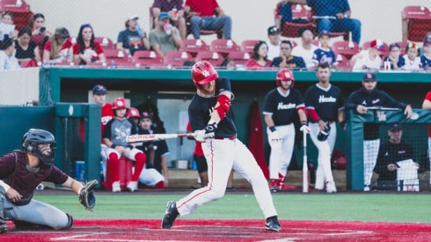 Cameron Nickens drives in a run for Team White in a Fall scrimmage.