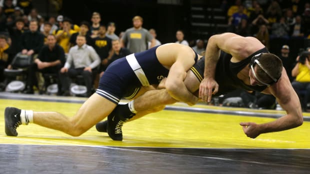 Penn State's Levi Haines shoots for a takedown against Iowa's Jared Franek in a Big Ten wrestling match at Carver-Hawkeye Arena.