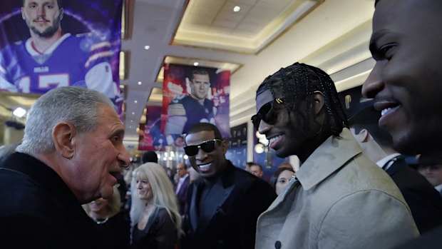 Sanders family with Atlanta Falcons owner Arthur Blank at NFL Honors